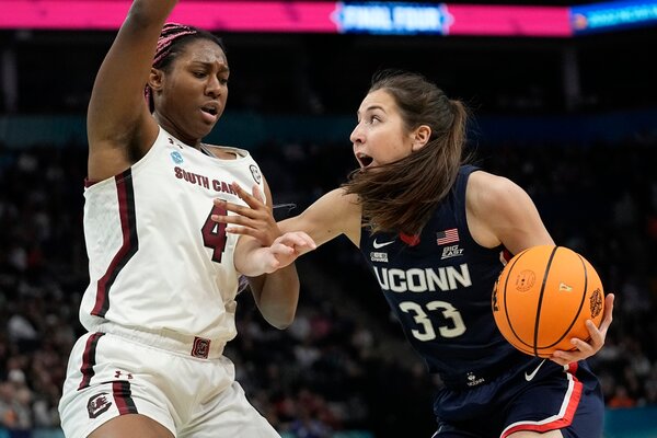 UConn's Caroline Ducharme, right, had 4 points off the bench in the first half.