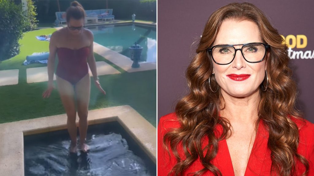 تُظهر Brooke Shields جسدها المنغمس في ملابس السباحة الحمراء لتغطس في عيد الشكر الجليدي